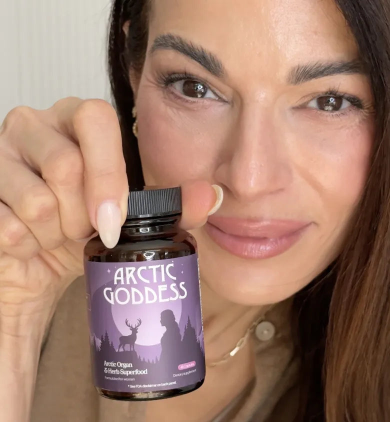 Woman holding a jar of Arctic Goddess